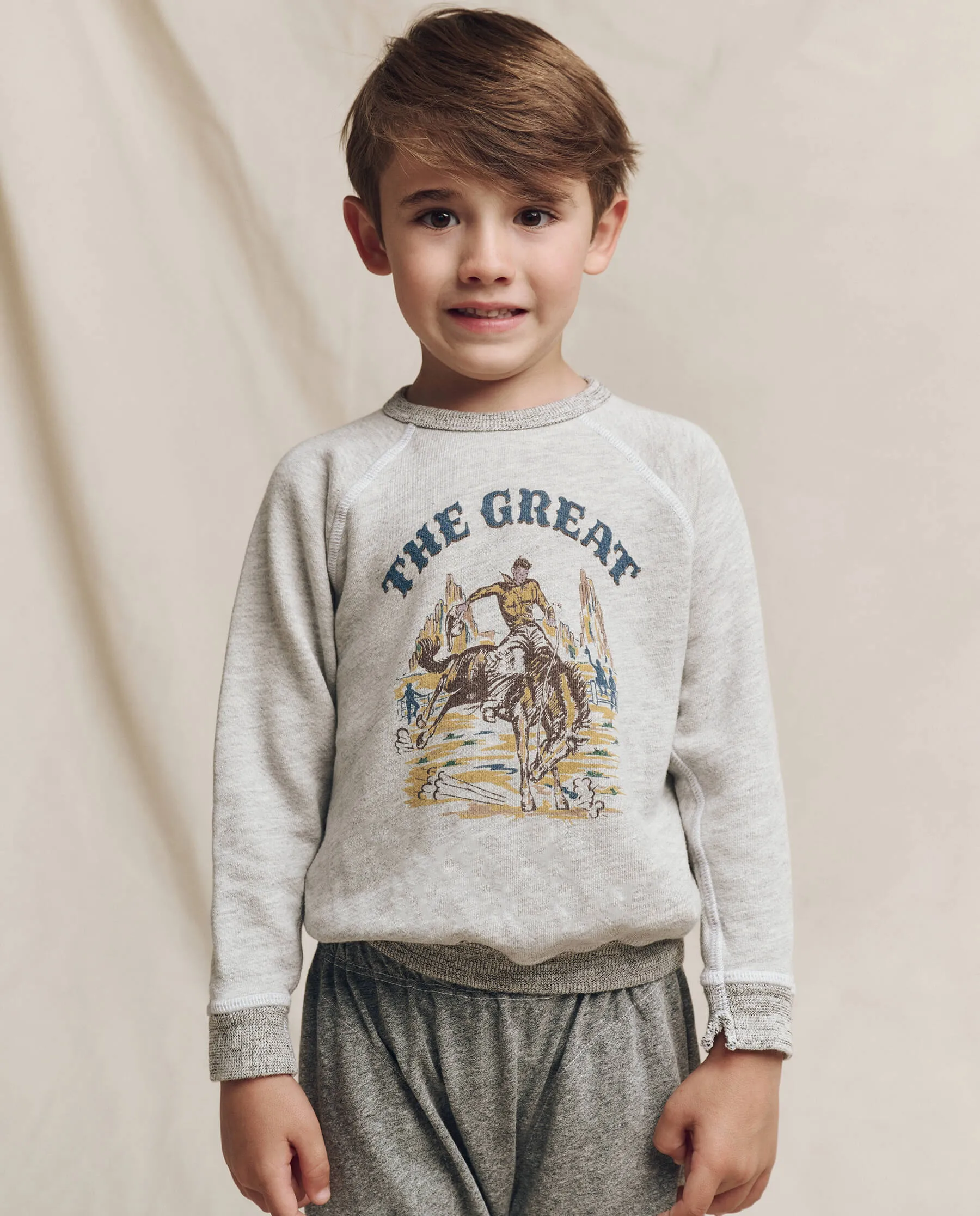 The Little College Sweatshirt. Graphic -- Soft Heather Grey with Rodeo Graphic